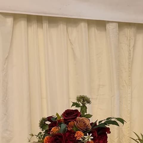 A close floral and fruit detail from a fully styled event setup.