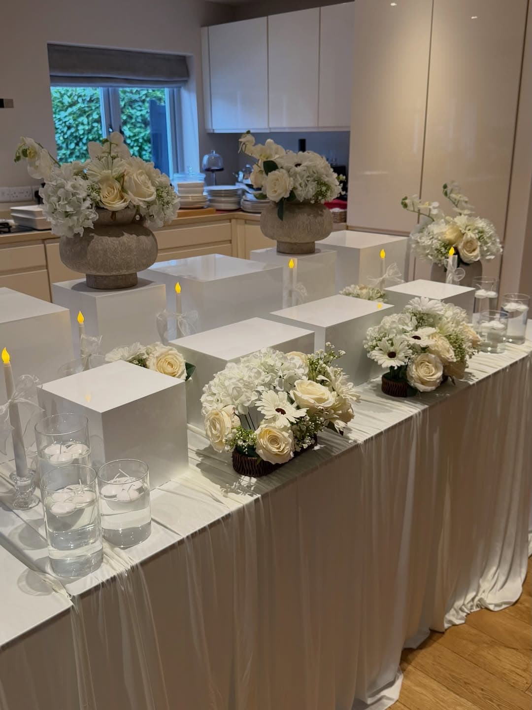 Photo by The Tablescapers | Events Décor | Creative Catering on March 04, 2026. May be an image of table, candle holder, tablecloth, flower arrangement, baby's breath and text.
