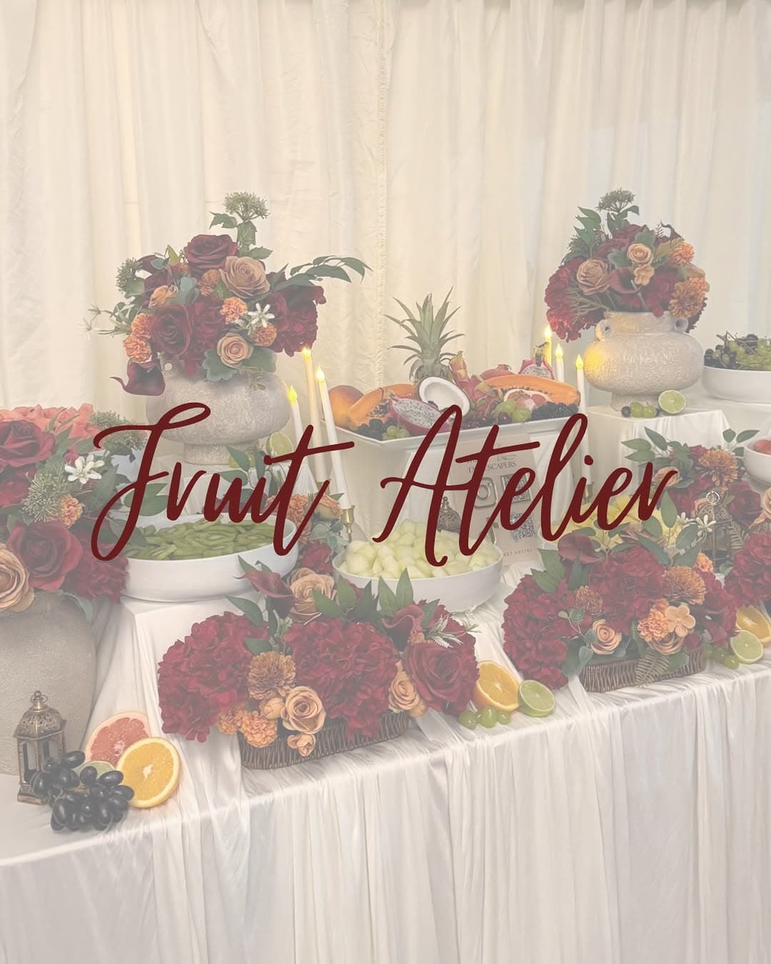 A social cover image for Fruit Atelier with a styled fruit display behind it.
