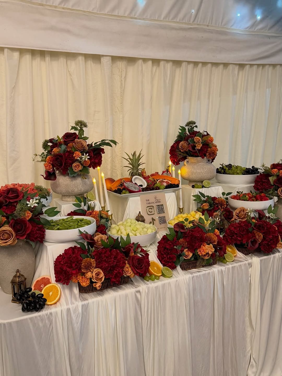 A richly styled fruit and floral display for creative catering.